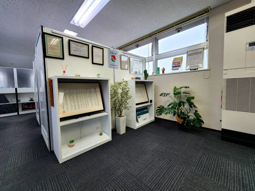 Interior office space with licenses and certificates on display
